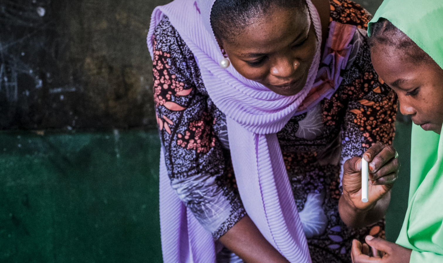 IRC learning facilitator Fatima teaches out of school children in Maiduguri, northeast Nigeria, as part of IRC's education in emergencies programming.