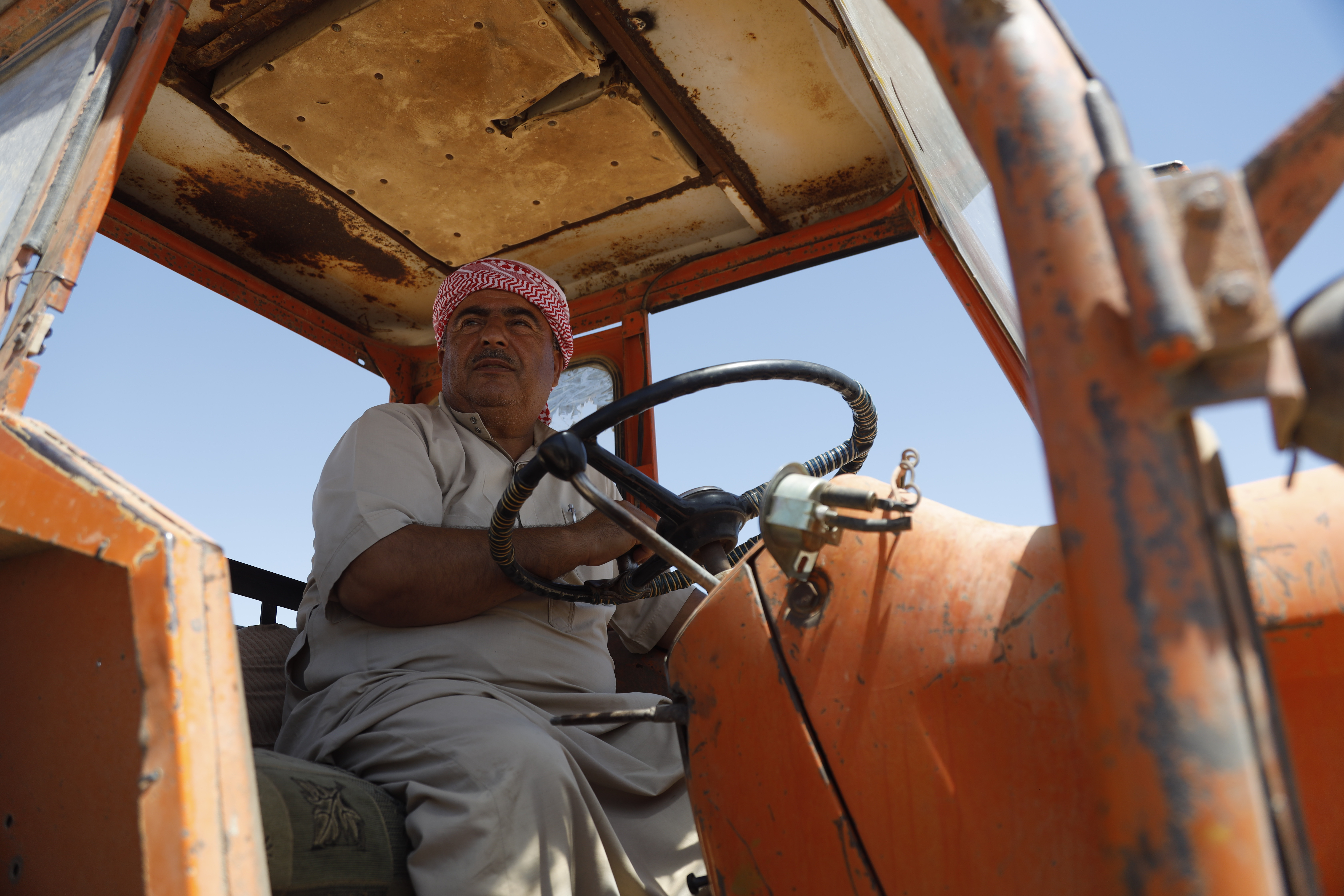 Participating farmer rides his tractor in northeast Syria