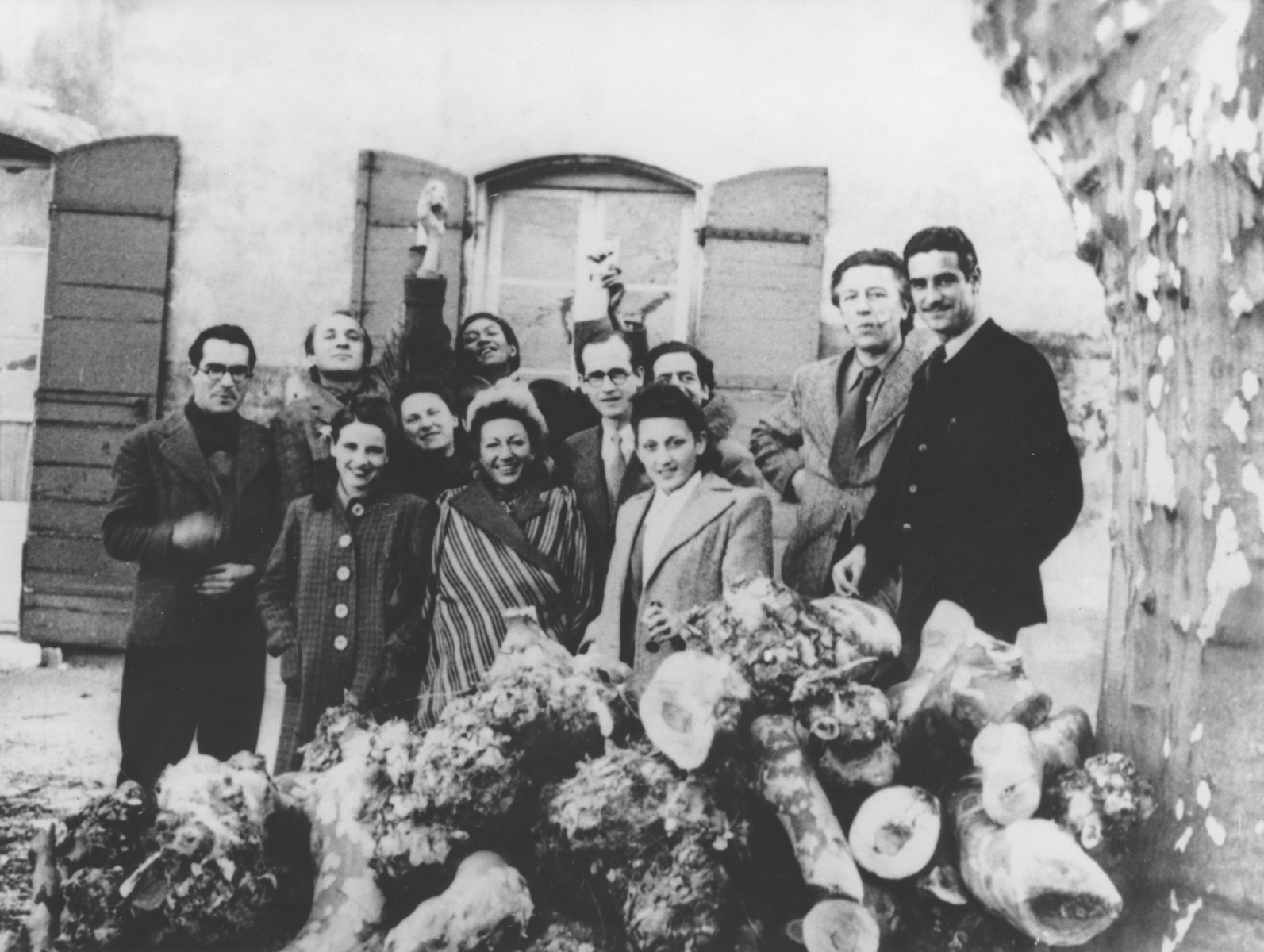 A group of artists with Varian Fry (center with glasses) at the Villa Air-Bel outside Marseilles, France, 1941.